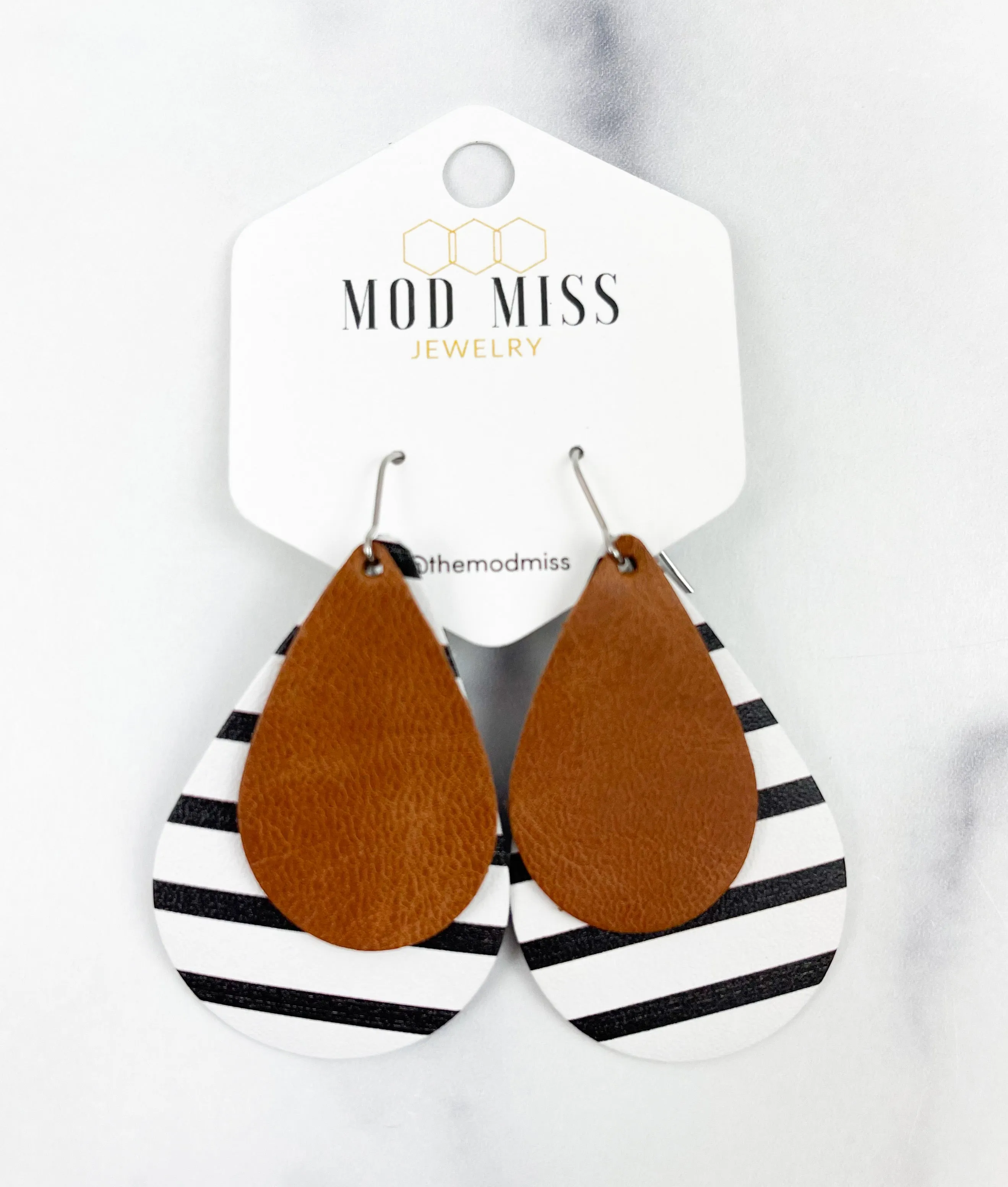 Leather Stacked Teardrop Earring Worn Brown on Black & White Stripes (Thick Stripes)